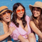 three-happy-young-friends-beach-vacation-look-camera_543206-571